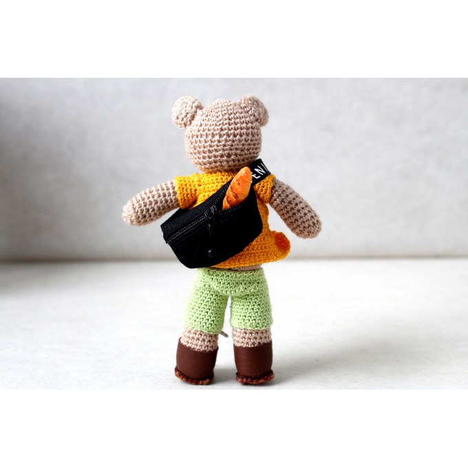 Crochet teddy bear tourist with clothes. Small cute 