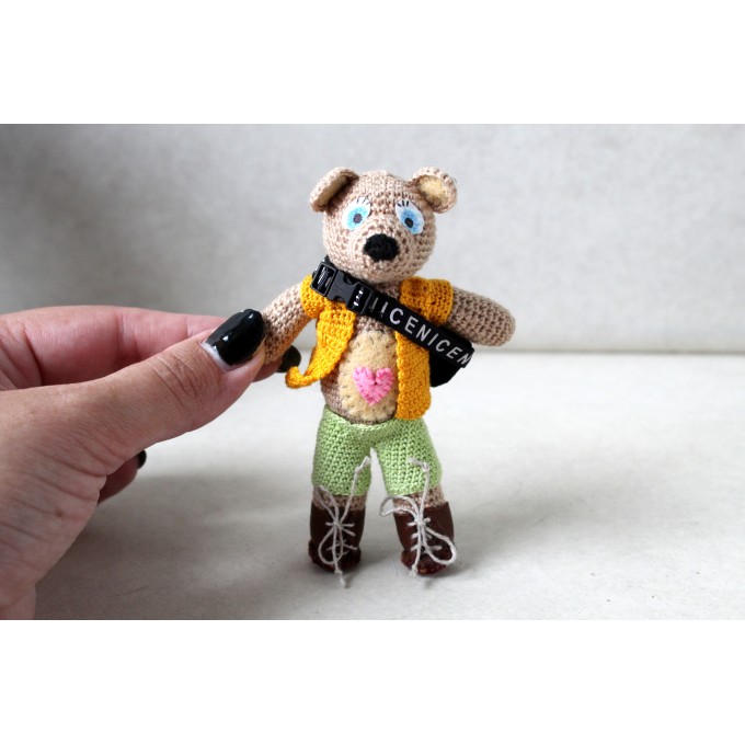 Crochet teddy bear tourist with clothes. Small cute 